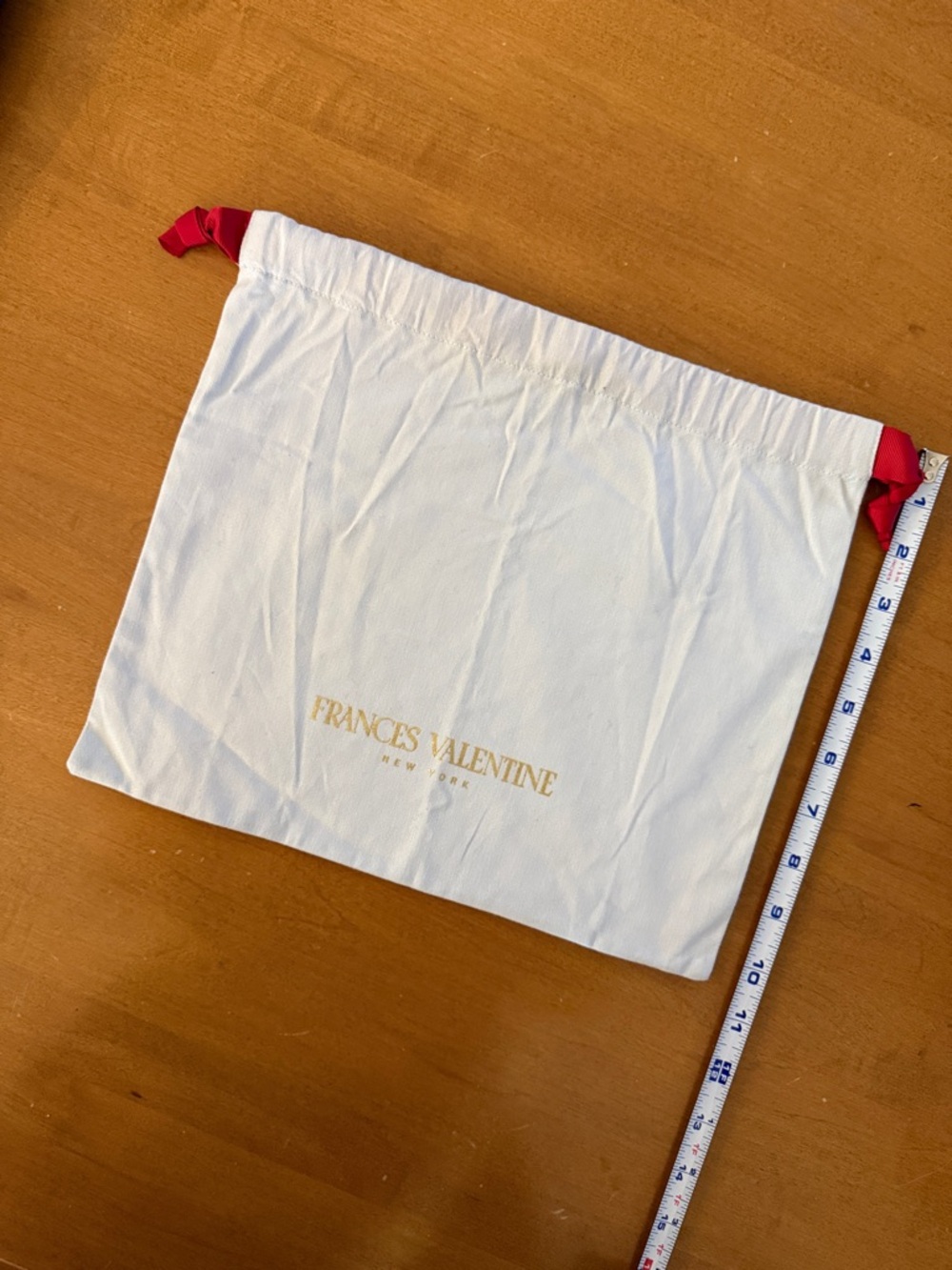 Frances Valentine cream canvas dust bag with red drawstrings